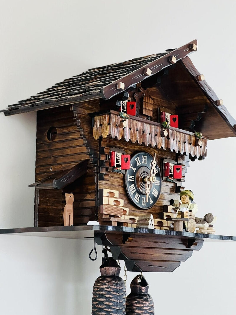 Eight Day Chalet Cuckoo Clock with Carved Deer, Dog, and Beer Drinker Drinking Beer - 12 Inches Tall