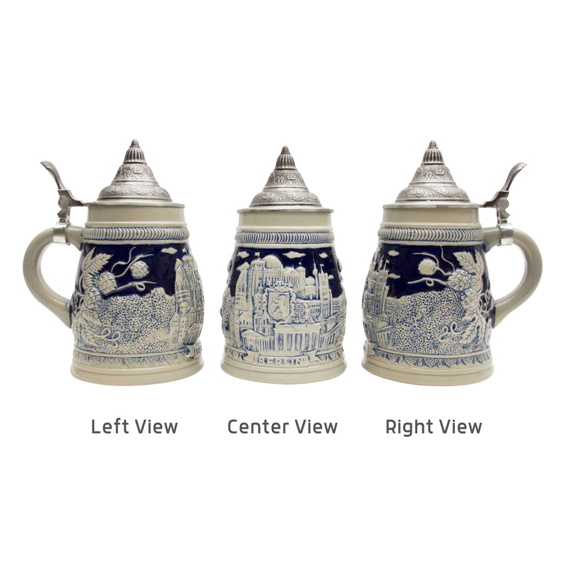 A cobalt blue ceramic beer stein that truly captures the essence of Berlin. This .75 Liter German-themed beer stein with an ornate metal lid has accents of beer hops and the iconic landmarks of Berlin such as the Brandenburg Gate and the Reichstag Bu