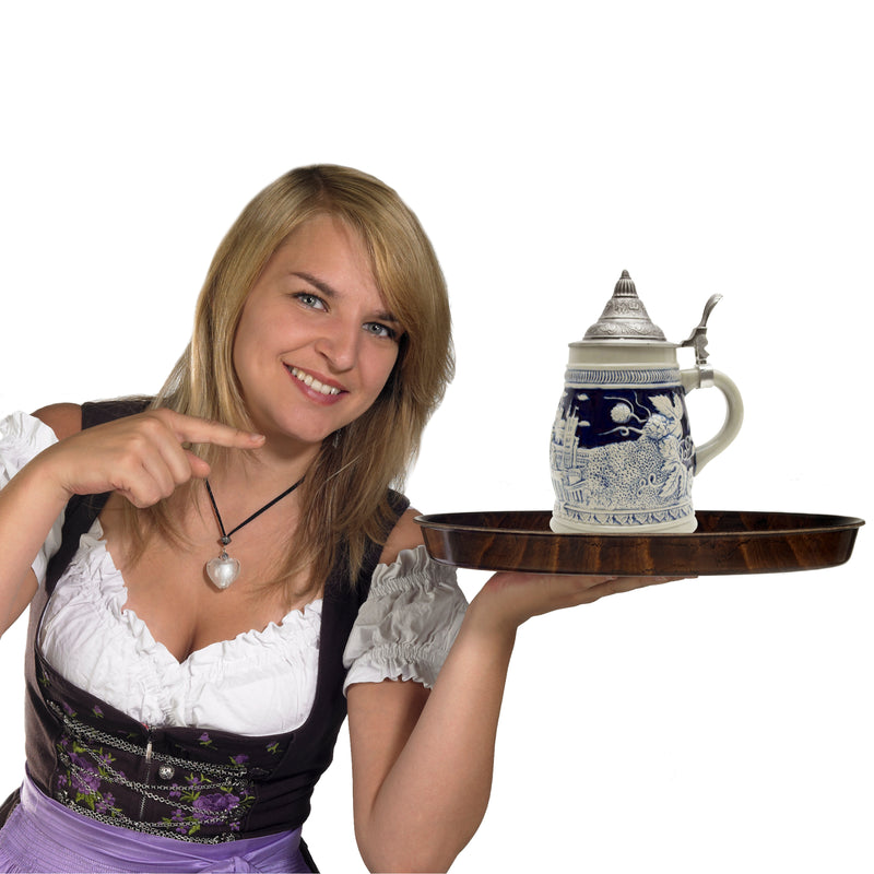 A cobalt blue ceramic beer stein that truly captures the essence of Berlin. This .75 Liter German-themed beer stein with an ornate metal lid has accents of beer hops and the iconic landmarks of Berlin such as the Brandenburg Gate and the Reichstag Bu