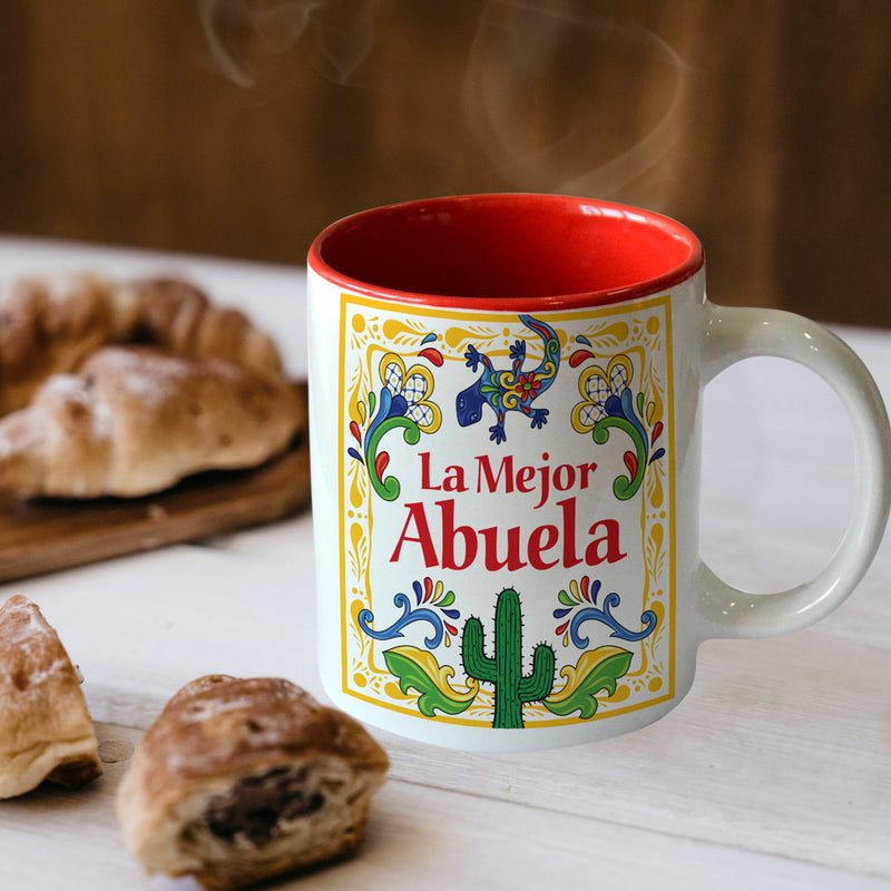 Provide a Spanish accent to your home, or share the love with your family and friends with this charming ceramic coffee mug.  This product features the saying: ""El Mejor Abuela" (Grandma is the Greatest in English) with colorful artwork, including a gecko motif.  