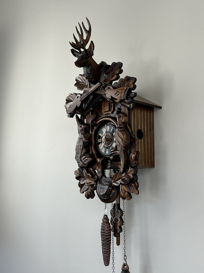 Hunter's Cuckoo Clock with Hand-carved Oak Leaves, Bunny, Bird, and Crossed Rifles, and Buck