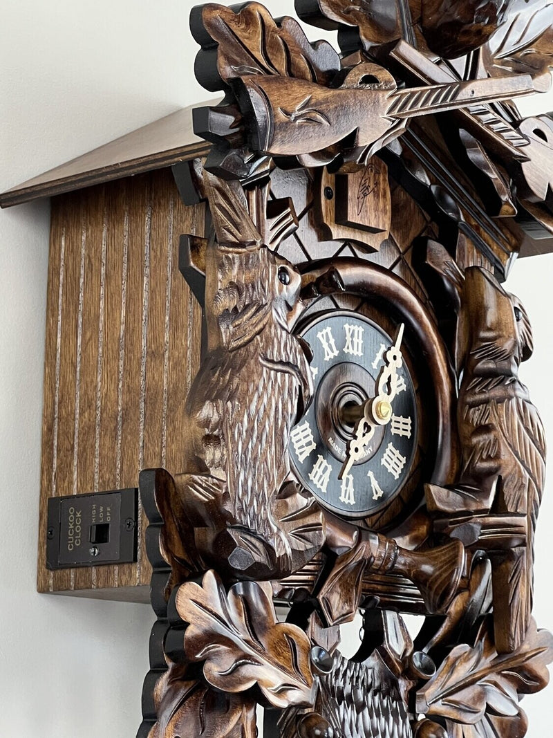 Hunter's Cuckoo Clock with Hand-carved Oak Leaves, Bunny, Bird, and Crossed Rifles, and Buck