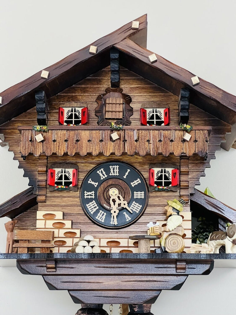 Eight Day Chalet Cuckoo Clock with Carved Deer, Dog, and Beer Drinker Drinking Beer - 12 Inches Tall