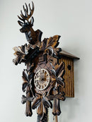 Eight Day Hunter's Cuckoo Clock with Hand-carved Maple Leaves, Rifles, and Buck