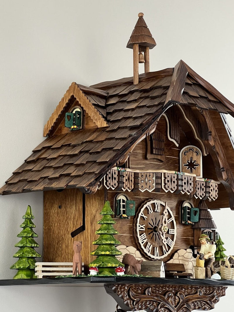 Eight Day Cuckoo Clock  - Cottage, Turret, Man Chopping Wood