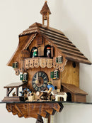 One Day Musical Cuckoo Clock Cottage with Man Sawing Wood, Waterwheel and Dancers