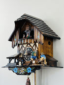 One Day Musical Cuckoo Clock with Men Sawing Wood, Waterwheel, and Dancers