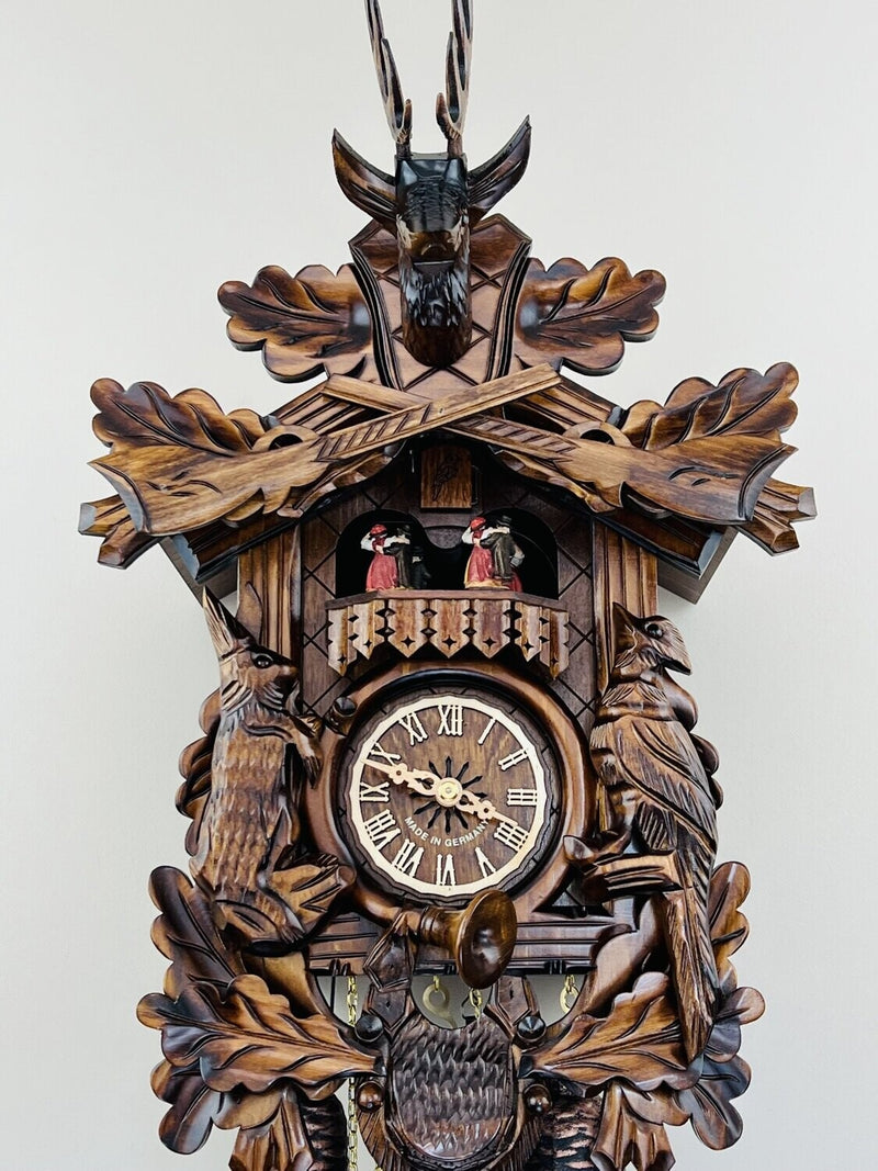 Eight Day Musical Hunter's Cuckoo Clock with Dancers - Hand-carved Live Animals, Leaves, and Buck