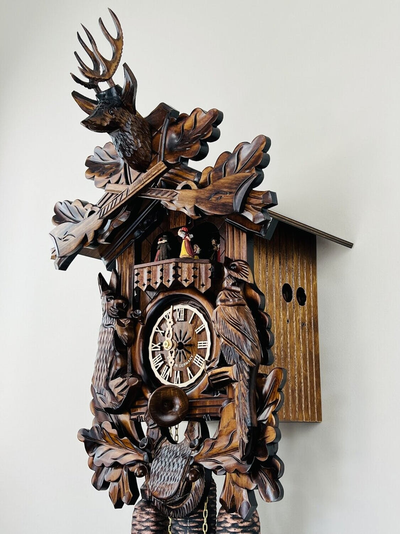 Eight Day Musical Hunter's Cuckoo Clock with Dancers - Hand-carved Live Animals, Leaves, and Buck