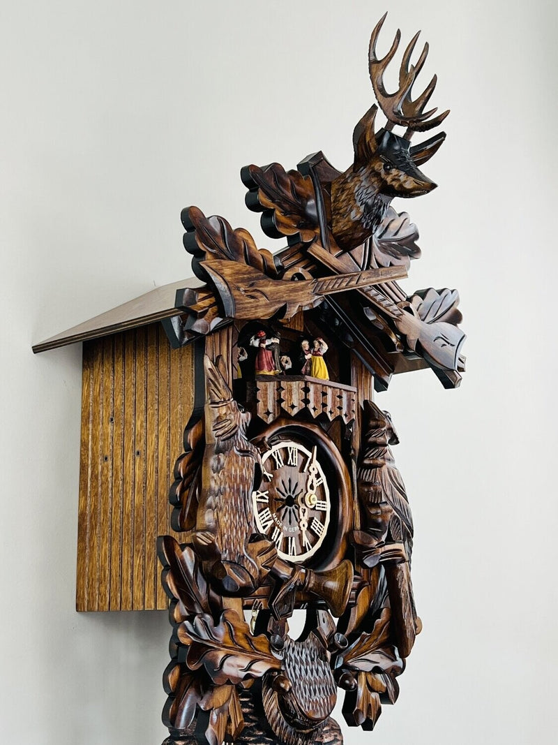 Eight Day Musical Hunter's Cuckoo Clock with Dancers - Hand-carved Live Animals, Leaves, and Buck