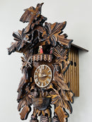 Eight Day Musical Cuckoo Clock with Hand-carved Birds, Leaves, and Chicks in Nest