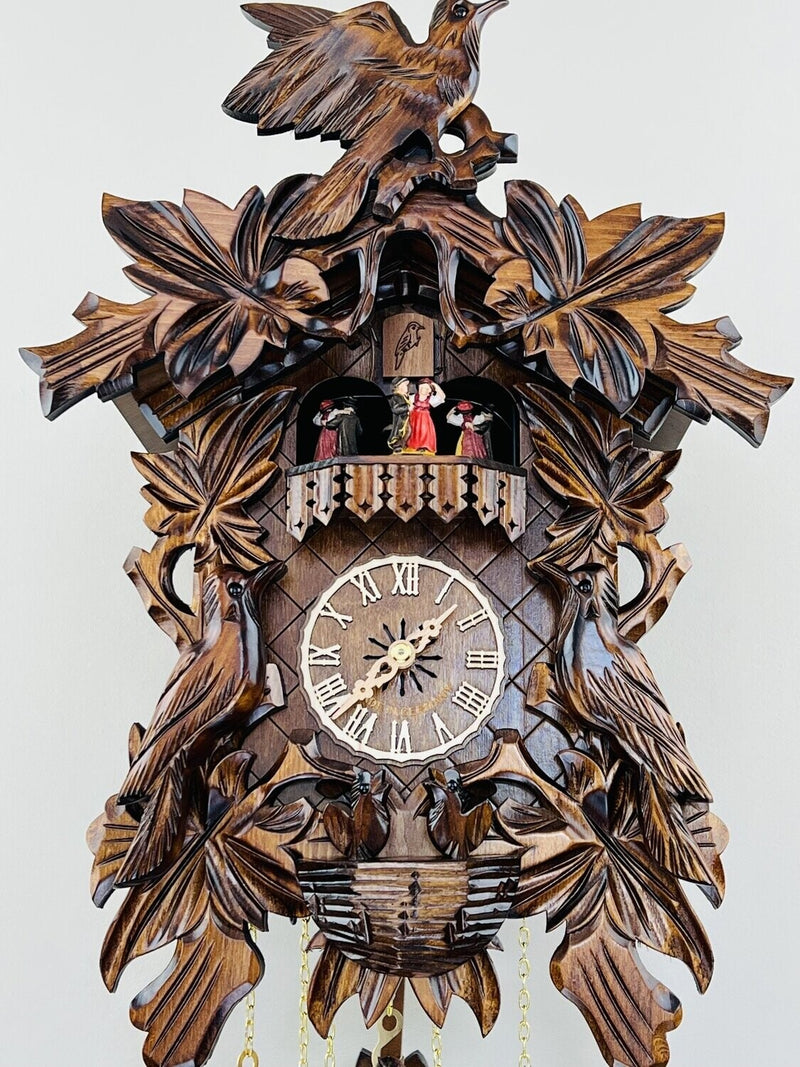 Eight Day Musical Cuckoo Clock with Hand-carved Birds, Leaves, and Chicks in Nest