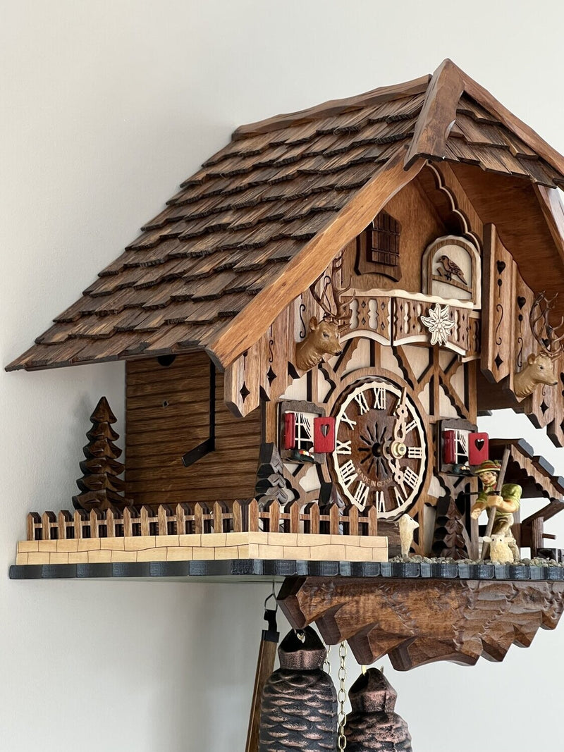 Eight Day Cuckoo Clock Chalet Volksmarcher raises staff