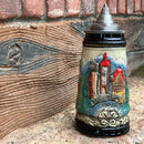 Classic scenes of Deutschland from mountain castles to famous landmarks featured on this ceramic beer stein with an ornate metal lid. This beer stein will make for a great classic gift or addition to your collection