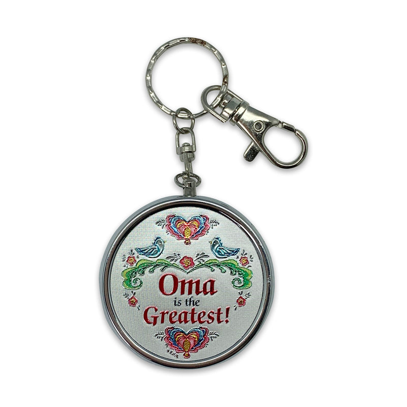 "Oma is the Greatest!" Metal Round Pill Box Keychain