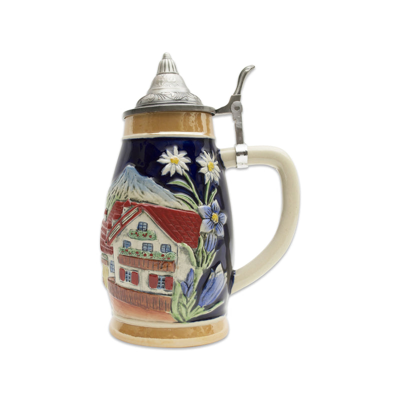 A beautiful presentation of a German Alpine scene with a Chalet and Edelweiss motifs artfully presented around this .75 Liter ceramic beer stein. This beer stein is topped off with an ornate metal lid.